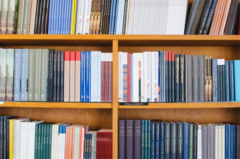 Shelves of books and bound journals in a university library