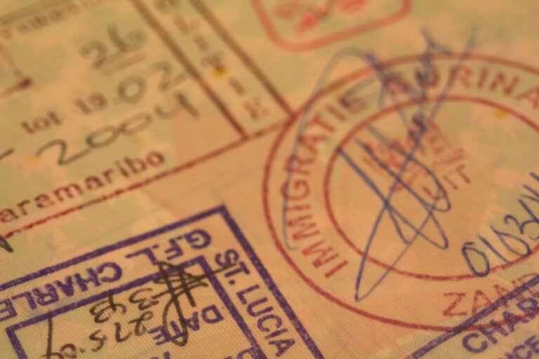 Close-up of entry and exit stamps in a passport